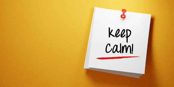 istock White Sticky Note With Keep Calm Message And Red Push Pin On Yellow Background 941184028