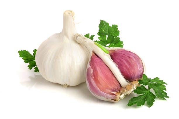istock garlic with parsley leaf isolated on white background 941184304