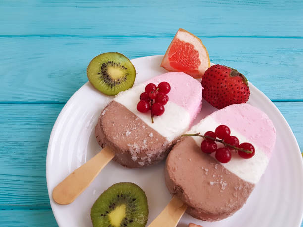 istock ice cream with red currant on blue wooden, grapefruit 941186438