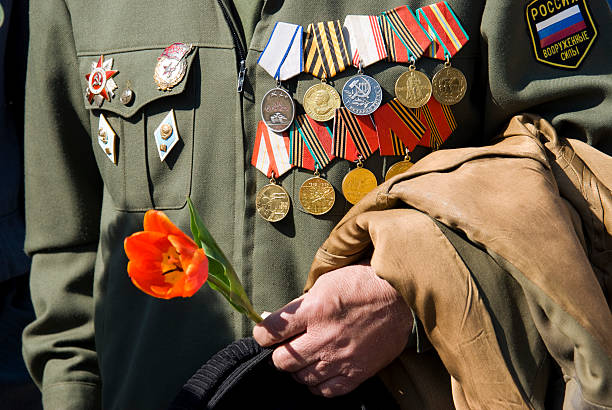 istock hand of war veteran with tulip 94118768