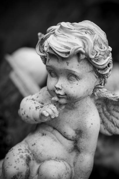 istock stoned angel on tomb in cemetery 941190082