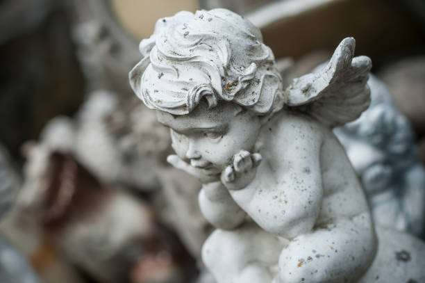 istock stoned angel on tomb in cemetery 941190108