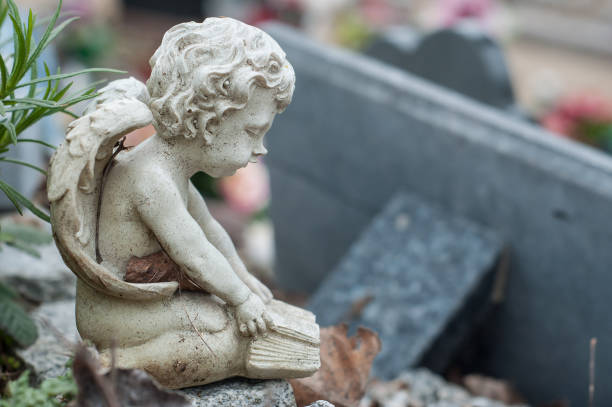 istock stoned angel on tomb in cemetery 941191796