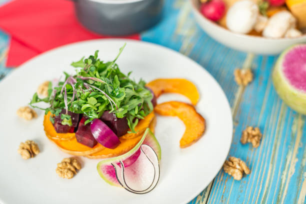 istock Vegetable vegetarian salad in a white plate 941193654