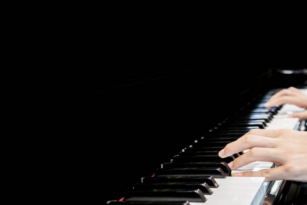 istock Close up musician hand playing piano 941194504