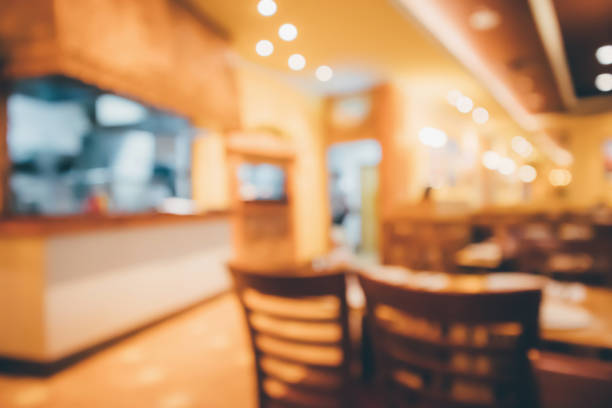 istock Restaurant cafe or coffee shop interior with people abstract defocused blur background 941194696