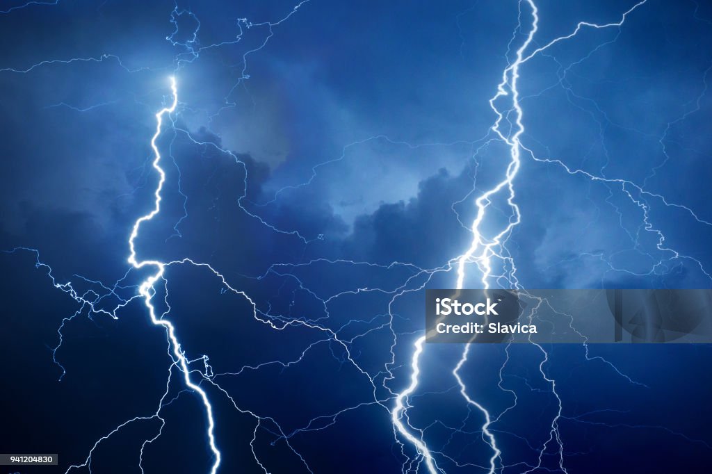 Lightning During Storm At Night Stock Photo - Download Image Now - Lightning, Thunderstorm, Blue - iStock Lightning During Storm At Night Stock Photo - Download Image Now - Lightning, Thunderstorm, Blue - iStock