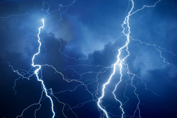 Lightning during storm at night stock photo