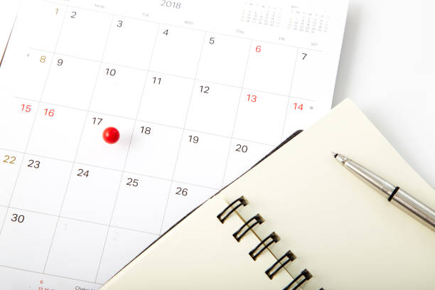 istock Tax day Red push pin on calendar 941213918