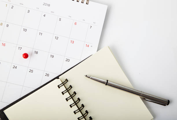 istock Tax day Red push pin on calendar 941213960