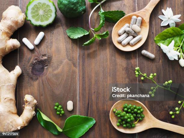 Herbal Pills In Wooden Spoon Stock Photo - Download Image Now - Herbal Medicine, Nutritional Supplement, Herb