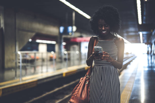 istock Girl waiting the train at station 941218508