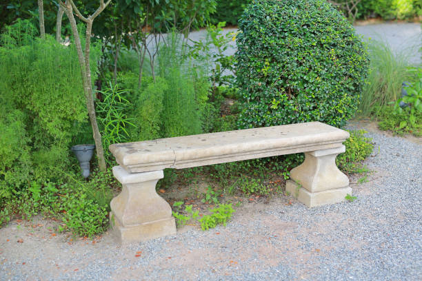 istock Old and broken long cement bench in the public park. 941228698