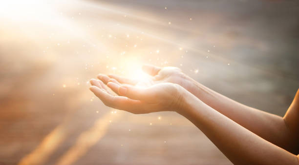 Woman hands praying for blessing from god on sunset background Woman hands praying for blessing from god on sunset background female magician stock pictures, royalty-free photos & images