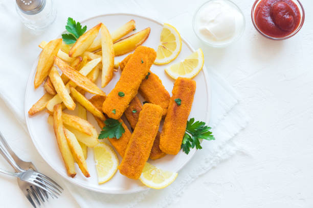 istock Fried Fish Sticks with French Fries 941233030