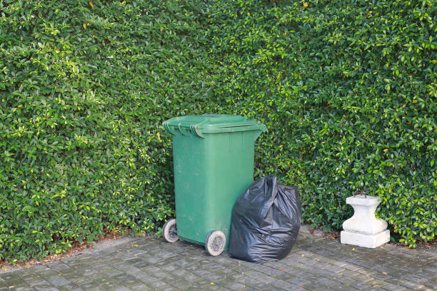 istock Plastic trash bags and rubbish bin in a park. 941233554