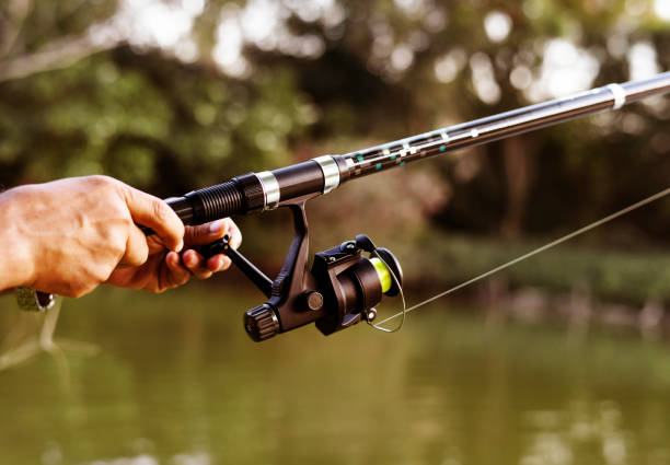 istock Man fishing in the jungle 941233694