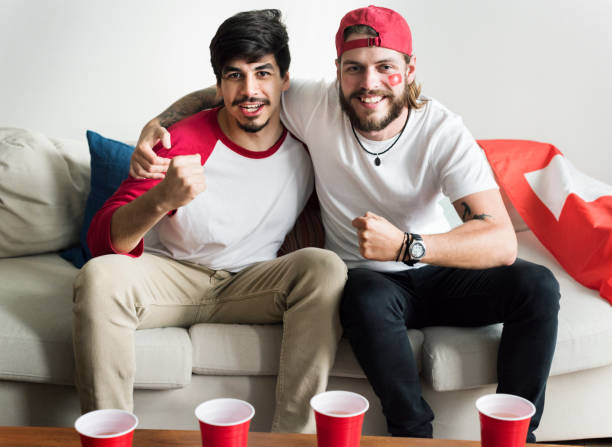 istock Friends cheering world cup with painted flag 941238928