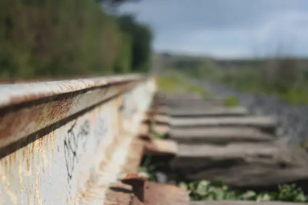 An old rusted railroad by a beach near Santa Cruse.