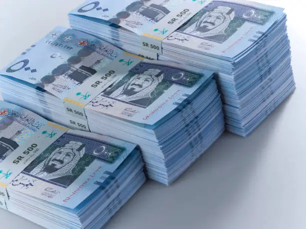 Stacks of Saudi Riyal Banknotes of 500 with image of King Abdulaziz Closeup