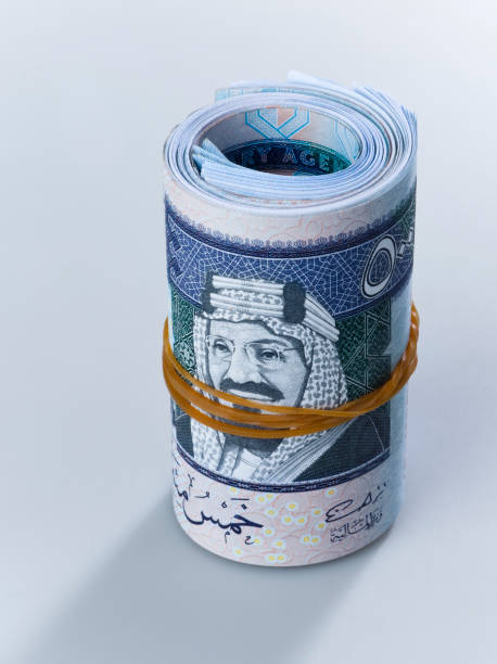 Roll of Saudi Riyal Banknotes of 500 with image of King Abdulaziz close up stock photo