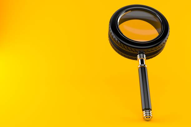 istock Magnifying glass in car tire shape 941245314