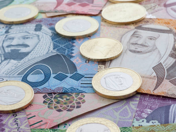 Saudi Riyal Banknotes and Coins showing King Salman of Saudi Arabia stock photo