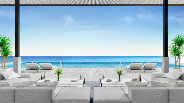 istock Relaxing summer, A modern beach lounge,sofa and sun loungers on Sunbathing deck and private swimming pool with  panoramic sea view at luxury villa /3d rendering 941248906