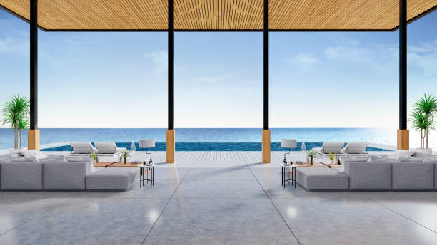 istock Relaxing summer, A modern beach lounge,sofa and sun loungers on Sunbathing deck and private swimming pool with  panoramic sea view at luxury villa /3d rendering 941248908