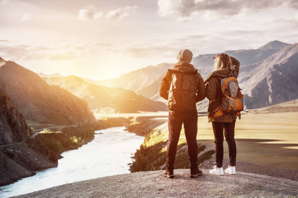 istock Couple backpackers travel mountains concept 941249980