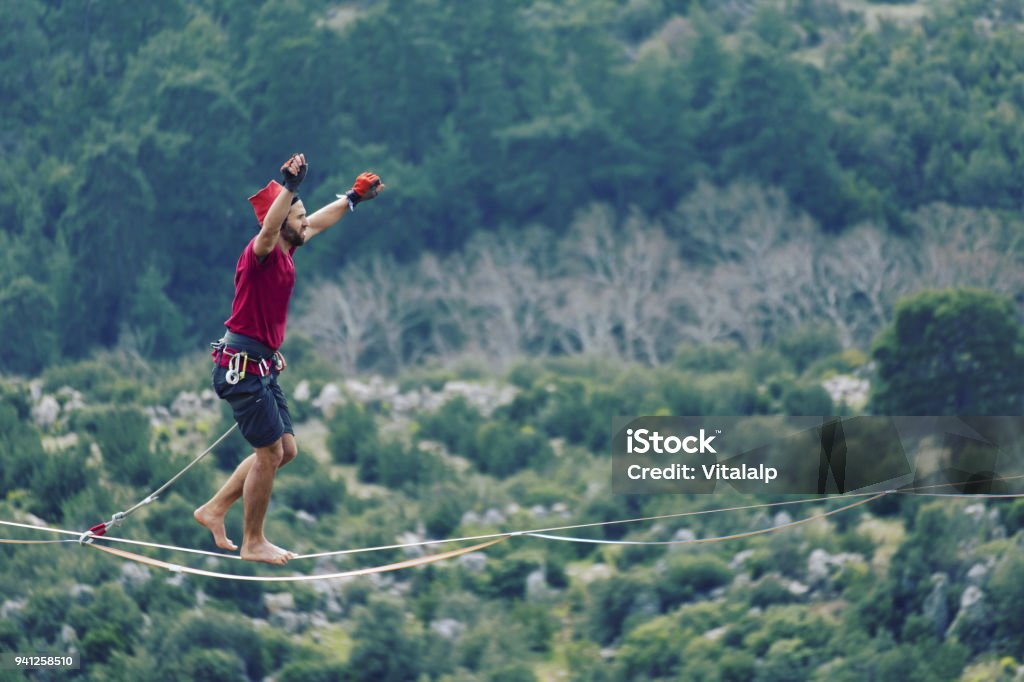 Walk a line in the sky.Turkish Highline Carnival in Antalya. Above Stock Photo