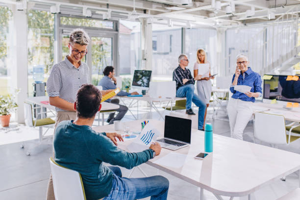 istock Large group of business people working in a modern office. 941265116