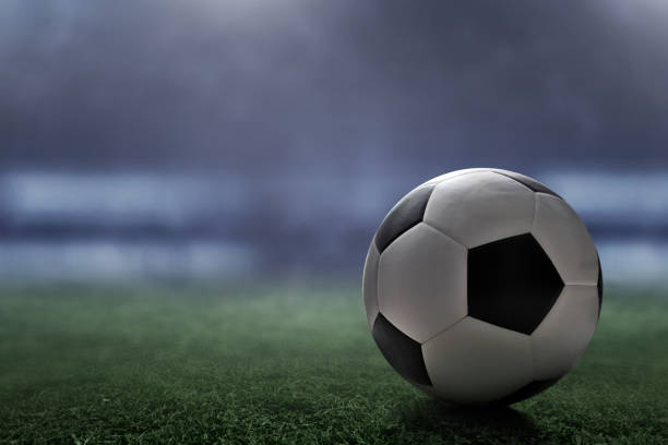 istock Soccer ball on the field 941268526