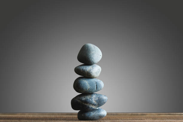 istock Stacked stones and gray background 941272944