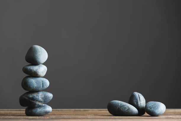 istock Stacked stones and gray background 941273066