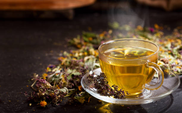 istock Cup of herbal tea with various herbs 941276296