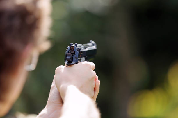 istock Young boy practice shooting guns on outdoor 941277770