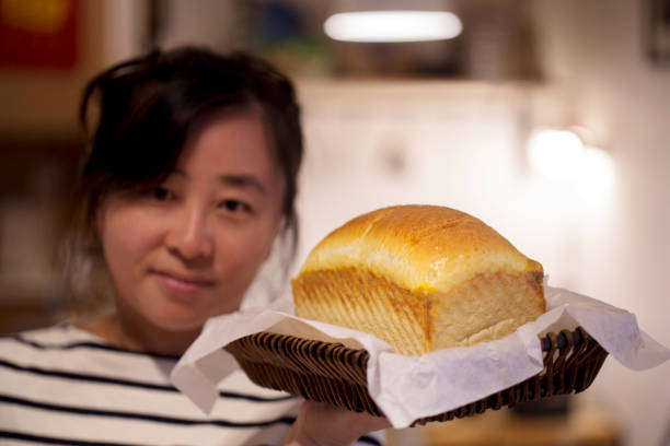young girl and fresh baked loaf