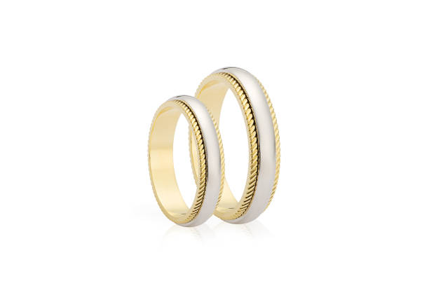 istock Two golden wedding rings isolated on white background 941278882