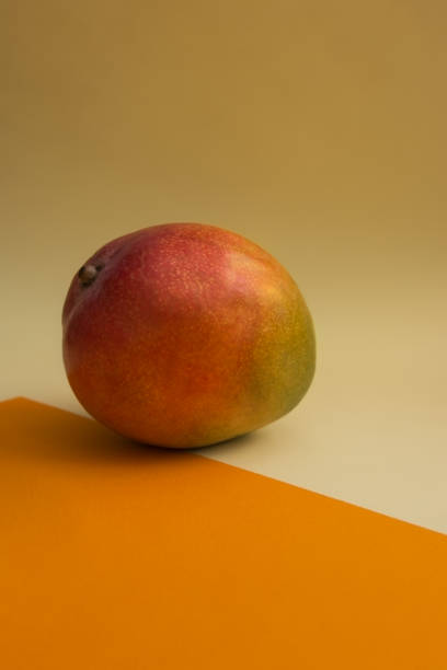 istock Fruit of mango on a colorful background 941281956