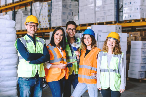 istock Group portrait of industry workers in distribution warehouse 941282096