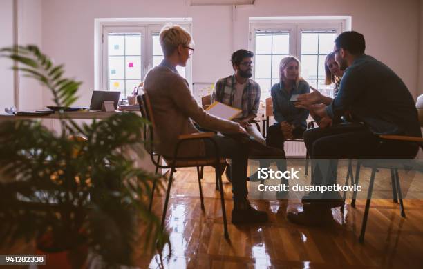 Young People With Problems Having A Discussion While Sitting Together On Special Group Therapy Stock Photo - Download Image Now