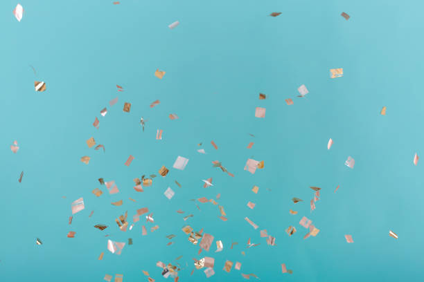 istock Golden confetti on pink background 941286108