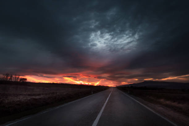 istock Straight road to sunset close to twilight 941288796
