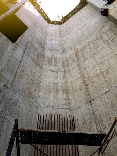 istock Concrete wall of big water tank building under construction 941288886