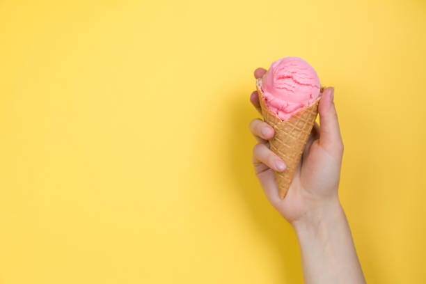 istock Hands holding ice cream in cones 941288928