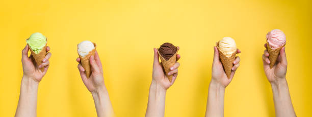 istock Hands holding ice cream in cones 941288984