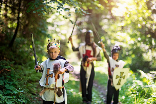 istock Kids playing knights in forest 941297556
