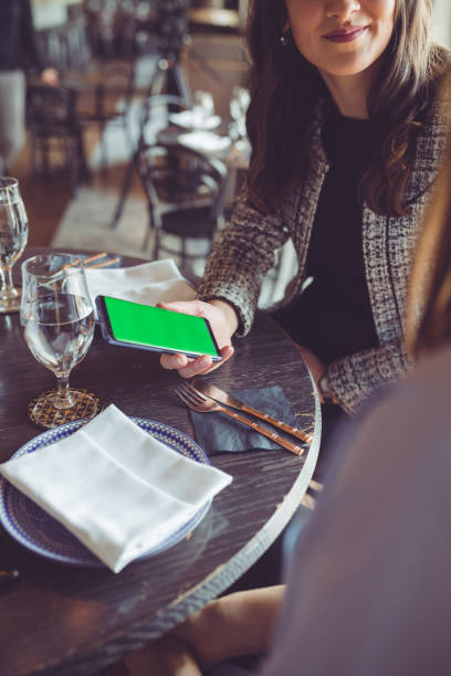 istock Women in cafe using smart phone 941297692