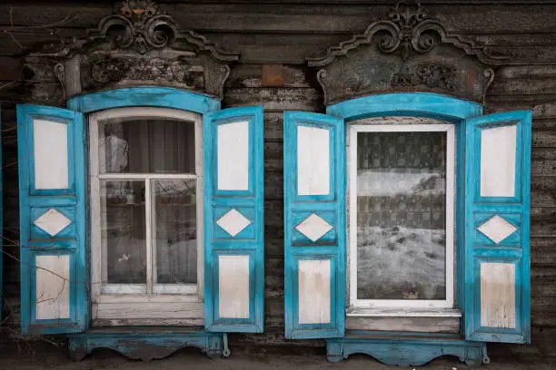 Blue Windows details of wooden house in winter in Irkutzk Siberia